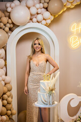 Celebration of elegance at a birthday party with a stylish cake and beautiful decorations