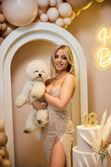 Celebrating an 18th birthday with family, friends, and a beloved puppy at a stylish event