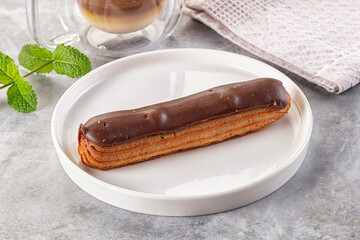 Gourmet chocolate eclair with icing