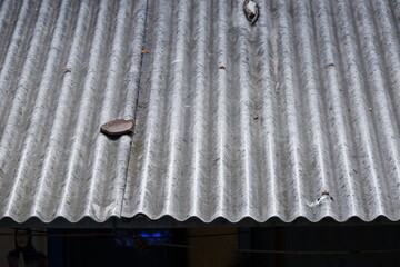 Detailed photo of asbestos roof of a house