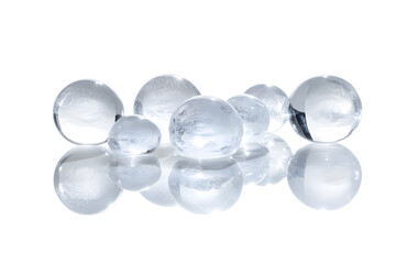 Cluster of hyaluronic acid bubbles varying in size with subtle reflections on their surfaces isolated on white background