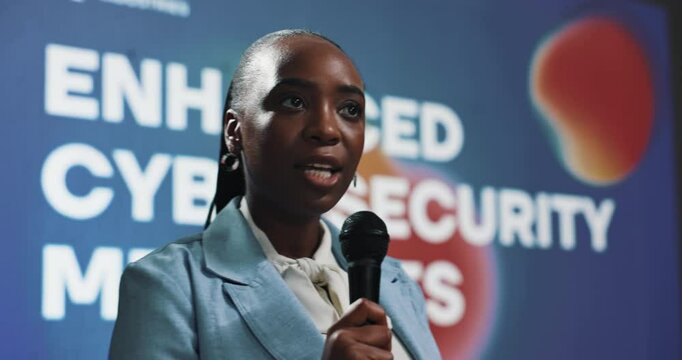 Business, presentation and black woman with cyber security, speaker and software update. African person, speech or presenter in seminar, mic or progress for tech, about us or programmer in conference
