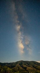 Majestic Milky Way Galaxy Over Rolling Hills at Night.
