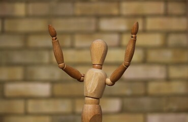 Wooden man praising