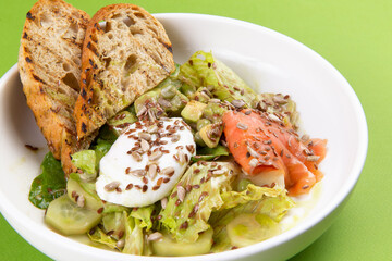 Salmon salad with poached egg.