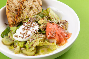 Salmon salad with poached egg.