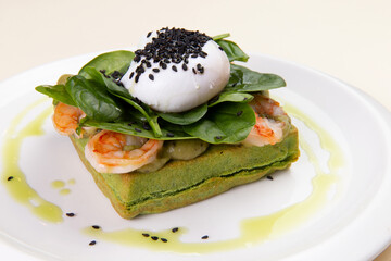 Sandwich with shrimp and poached egg.