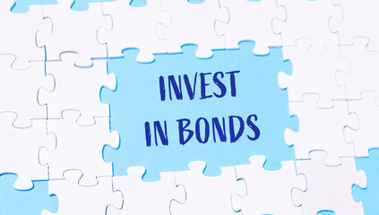 Jigsaw puzzle with the words invest in bonds written in blue
