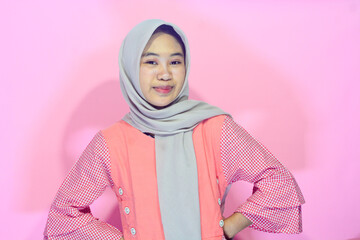 Muslim Indonesian woman with pointing body gesture who is a young businesswoman