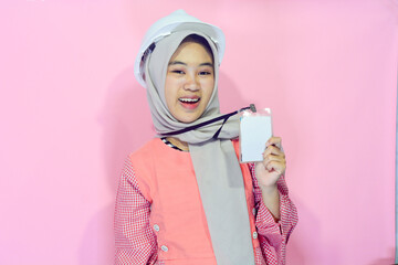Worker woman wearing safety vest and project helmet on isolated background