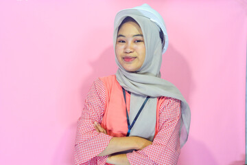 Worker woman wearing safety vest and project helmet on isolated background
