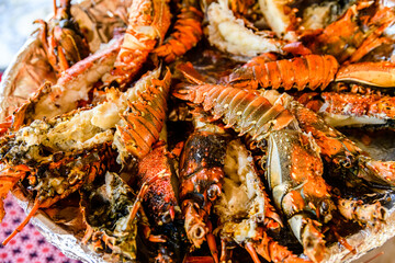 Prepared spiny lobsters on a plate. Exotic seafood