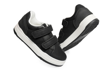 Black sport shoes on white background – isolated athletic footwear