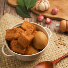 Tofu and egg stew in white bowl