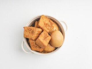 Tofu and egg stew in white bowl