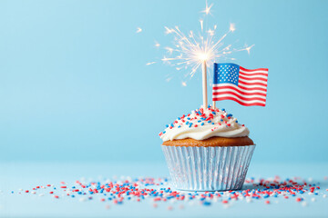 cupcake with a sparkler and an American flag on top
