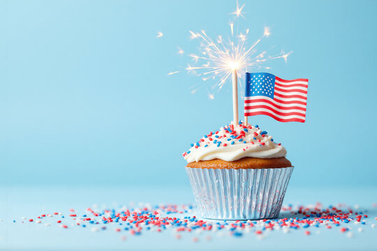 cupcake with a sparkler and an American flag on top