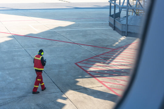 Airport ground worker man working in airport runway
