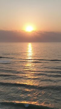 Florianopolis in Santa Catarina during a wonderful sunrise. Mo&ccedil;ambique Beach in aerial view, vertical video.
