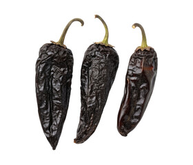 Three black dried Poblano Ancho chilies isolated on a transparent background png food design