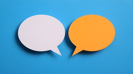 Two Speech Bubbles Highlighting Communication Concepts on a Vibrant Blue Background

