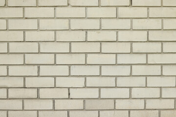 White brick wall, background. Light dirty brick, fence. Close-up of white brick exterior wall. Construction, building, close-up of house element