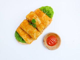 Indonesian risol mayo served on lettuce in a wooden tray with chili sauce in a wooden bowl, presented on a white background