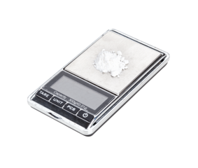 White powder narcotic on digital scales. Isolated