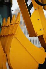 Close-Up of Heavy Yellow Construction Equipment with Hydraulic Arm