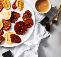 Letter-Stamped Pancakes with Coffee on White Table