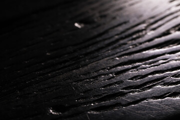 Close-Up of Textured Dark Wooden Surface with Natural Lines and Grooves