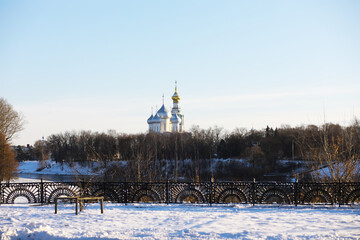 Winter Landscape with Snow-Covered Park and Historical Church in Frosty Weather