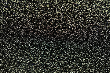 Glittering Abstract Texture with Dark Background and Sparkling Highlights