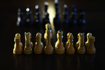 Strategic Chess Battle - Focused White Pieces in Forefront with Out-of-Focus Opposing Pieces in...