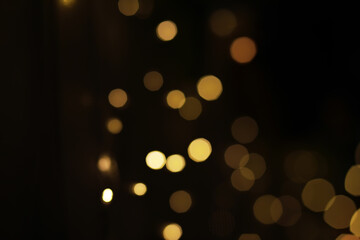 Blurred Golden Bokeh Lights on Dark Background - Abstract Festive Illuminations for Holiday Designs