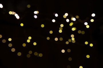 Abstract Blurred Festive Lights Background - Yellow and White Bokeh on Dark Backdrop
