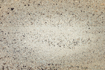 Textured background featuring a unique blend of colors and patterns on a concrete surface