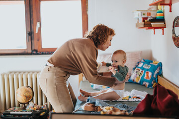 A loving moment between mother and baby, showcasing childcare and togetherness in a warm,...