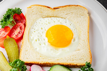Fried gashouse eggs in bread egg in the basket delicious snack breakfast in a bowl fresh delicious gourmet food background on the table rustic food top view copy space