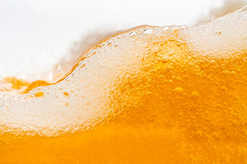 Close up bright orange Oil or beer splash texture and nature waves, Beautiful waves curve and...