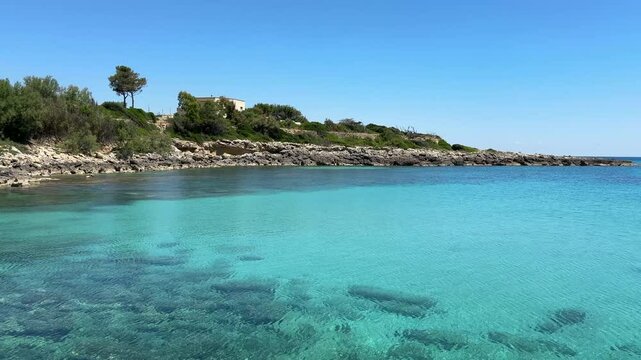 4K - Crystal Clear Turquoise Sea and Rocky Coastline in Taranto, Salento, Puglia, Italy