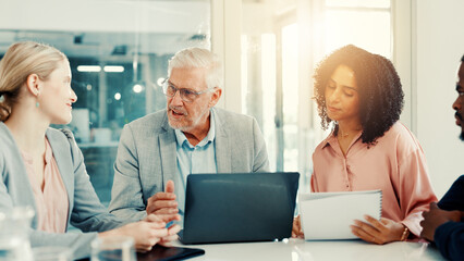Meeting, colleagues and group with laptop, discussion or investment idea in office or market trends. Corporate, financial analyst and people with tech for opportunity, talk and teamwork in boardroom