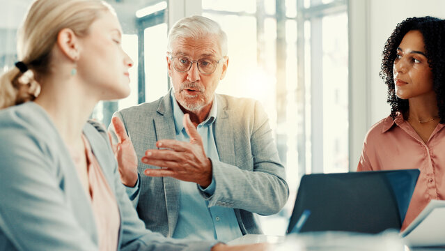 Boardroom, boss and group with laptop, talking and discussion for performance of employee in office. Meeting, financial analyst and conversation for return on investment, colleagues and people