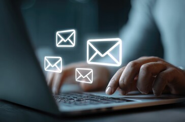 Person using laptop, email icons overlay