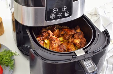 Cooking potatoes with chicken in  air fryer.