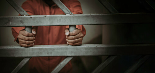 Hands of men desperate to catch the iron prison,prisoner concept,thailand people,Hope to be free,A...