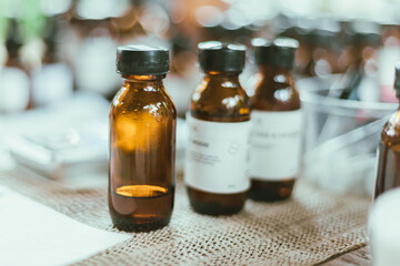 Shot of mature perfumer adding extra essential oil