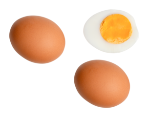 Top view set of raw brown chicken eggs and cooked or boiled chicken egg with egg yolk in half isolated with clipping path in png file format