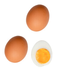 Top view set of raw brown chicken eggs and cooked or boiled chicken egg with egg yolk in half isolated with clipping path in png file format