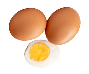 Top view of raw brown chicken eggs and cooked or boiled chicken egg with egg yolk in half isolated with clipping path in png file format